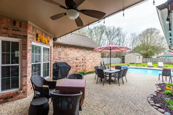 a patio with tables and chairs