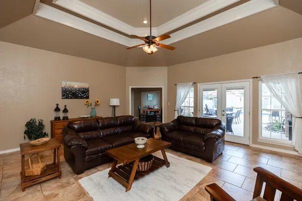 a living room with furniture and a large window