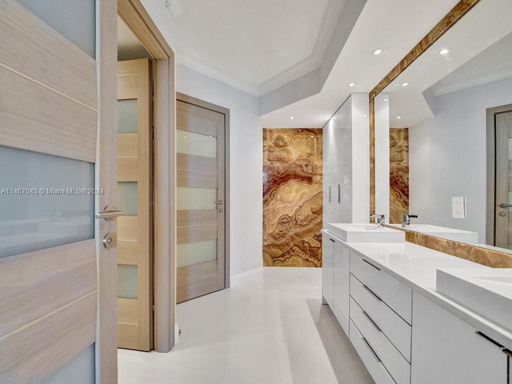 a spacious bathroom with a shower and a sink