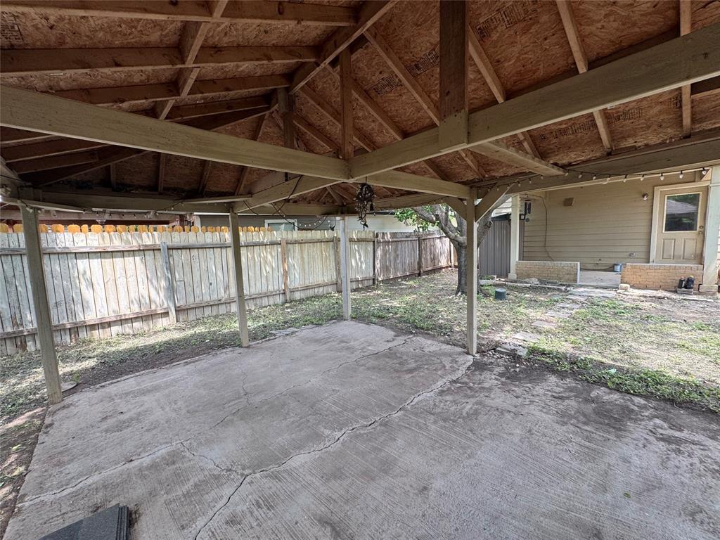 3200 Crownover Street Austin, TX 78725 - Photo 22 of 23 A private backyard oasis features a covered patio, ideal for outdoor entertaining.