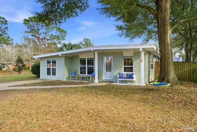 front view of a house with a swimming pool