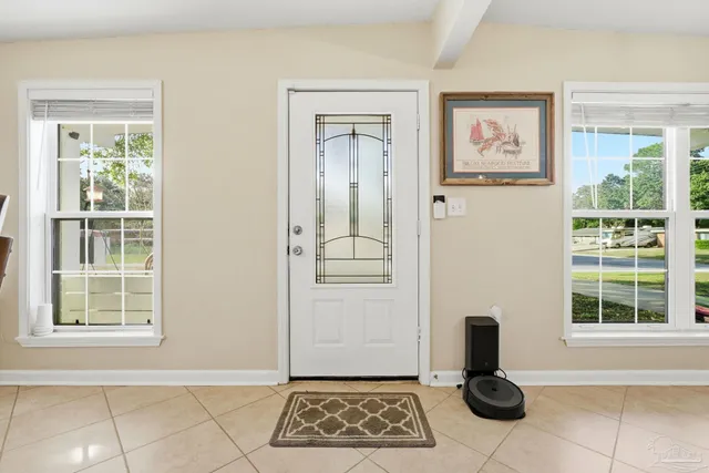 a view of a door and chair in a room