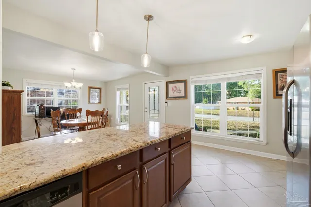 a kitchen with counter top space cabinets and wooden floor