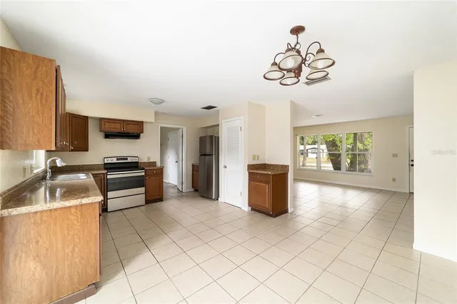 a view of a kitchen with a sink and dishwasher