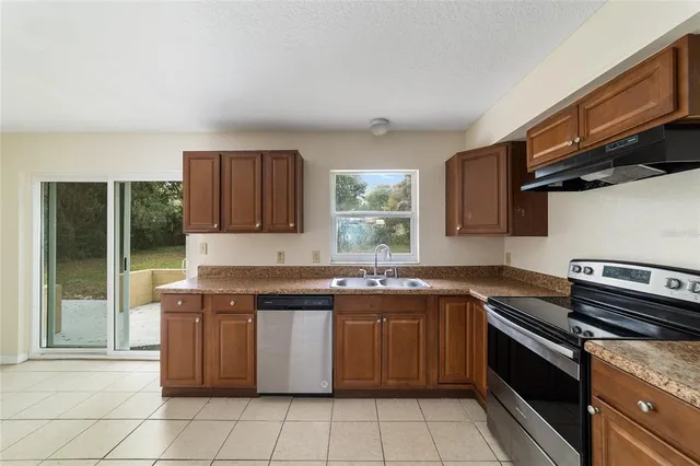 a kitchen with a refrigerator and a refrigerator