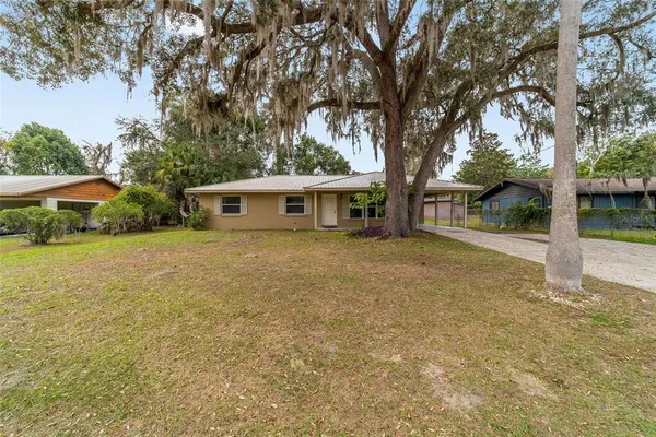 front view of a house with a yard