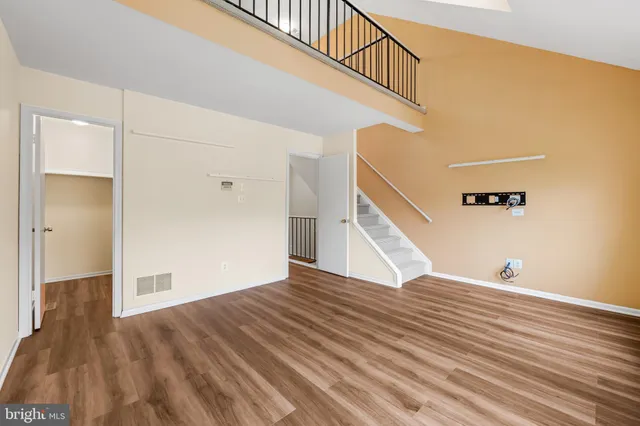 a view of an entryway with wooden floor
