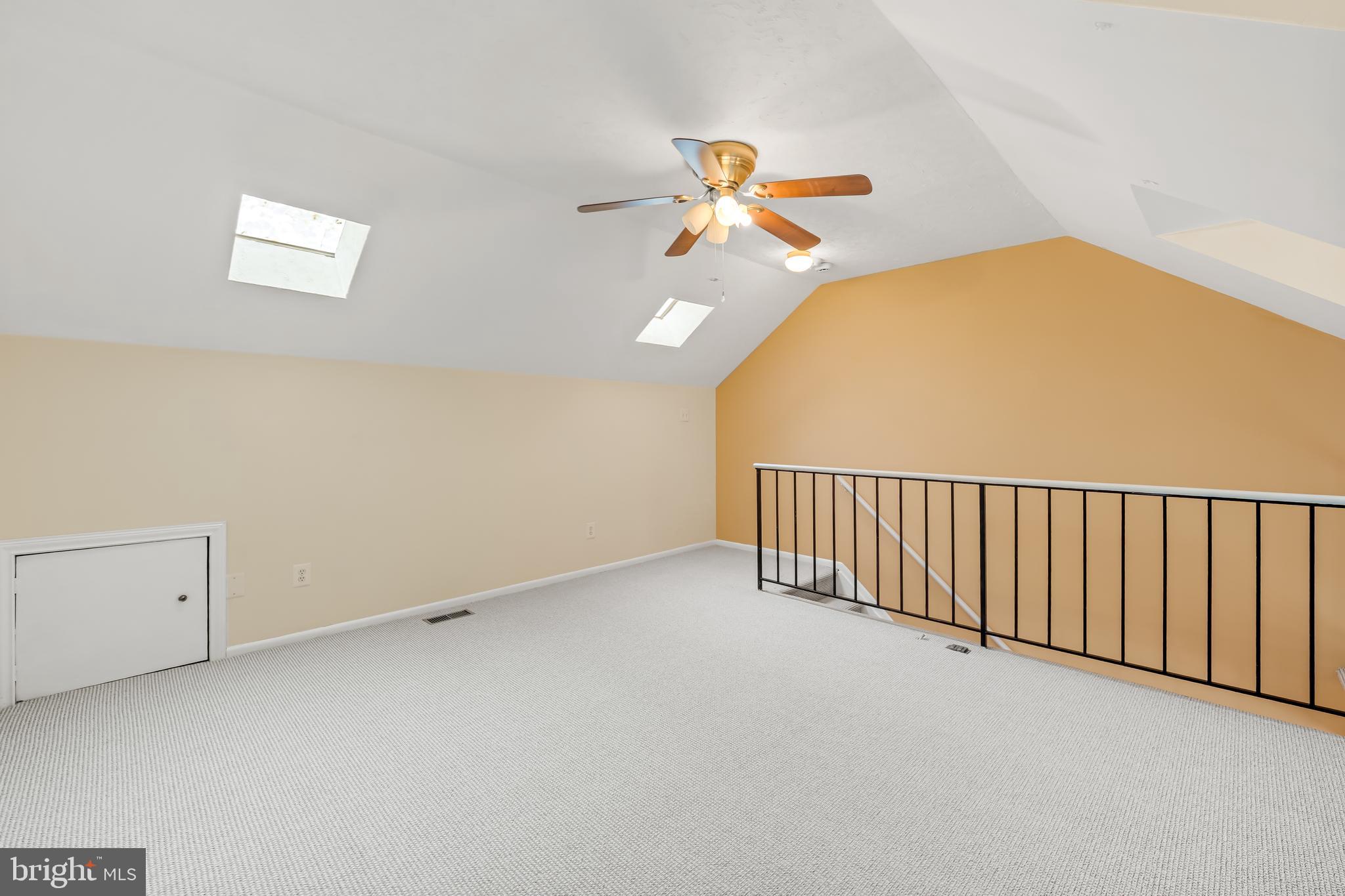 6953 Rockfield Road Baltimore, MD 21244 - Photo 19 of 31 a view of a hallway with a chandelier fan and a chandelier