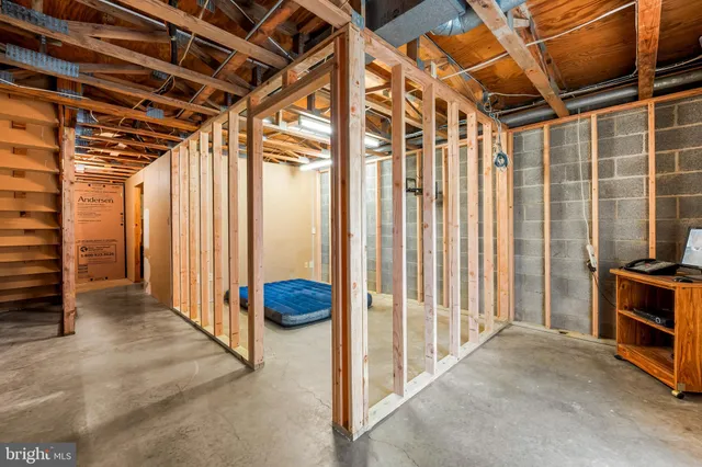 a view of a house with a yard and deck