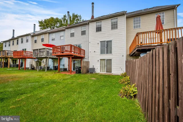 a view of backyard with garden and deck