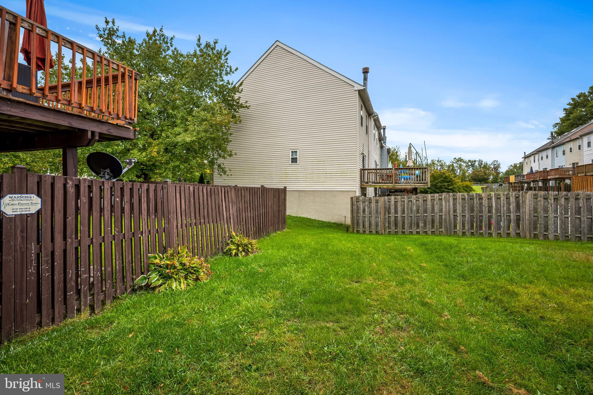 6953 Rockfield Road Baltimore, MD 21244 - Photo 26 of 31 a view of backyard with garden and deck