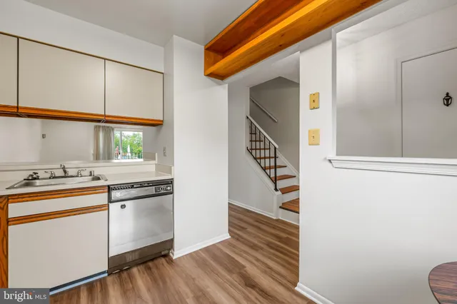 a kitchen with stainless steel appliances a sink and a window