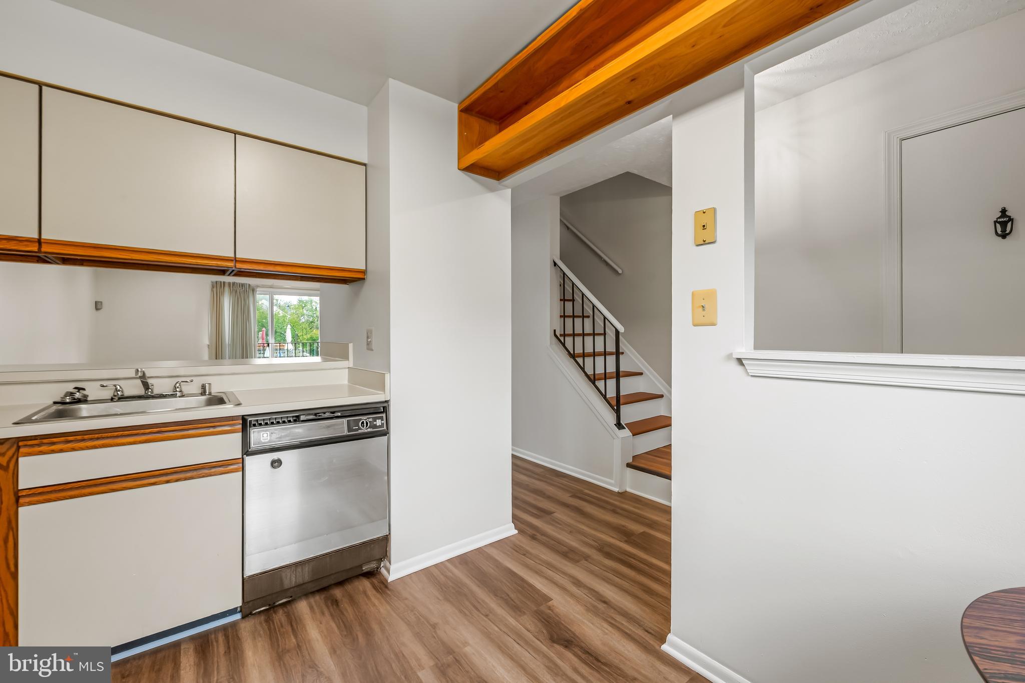 6953 Rockfield Road Baltimore, MD 21244 - Photo 8 of 31 a kitchen with stainless steel appliances a sink and a window