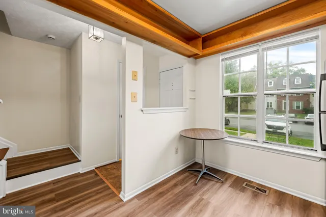 a view of a room with window and a table
