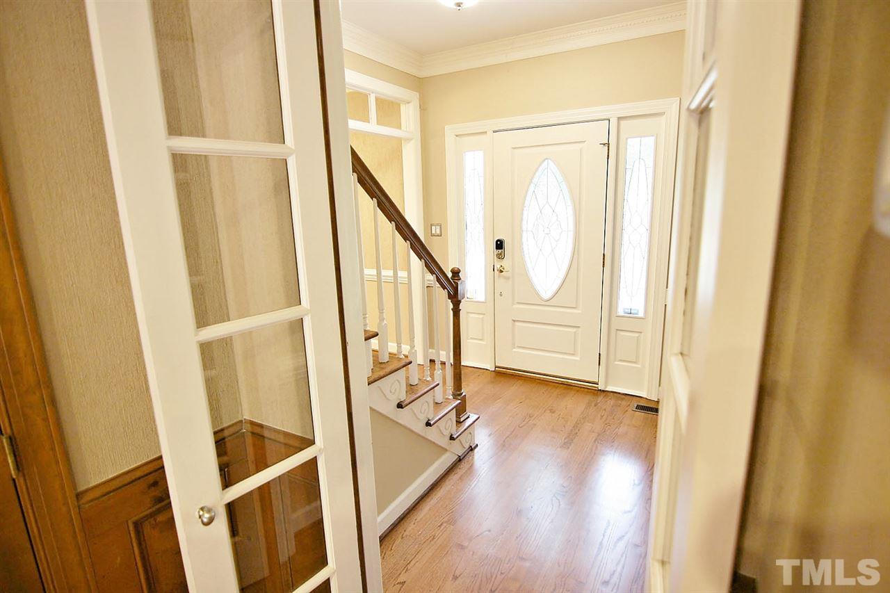 2001 Countrywood Road North Raleigh, NC 27615 - Photo 2 of 25 a view of an entryway with wooden floor and door