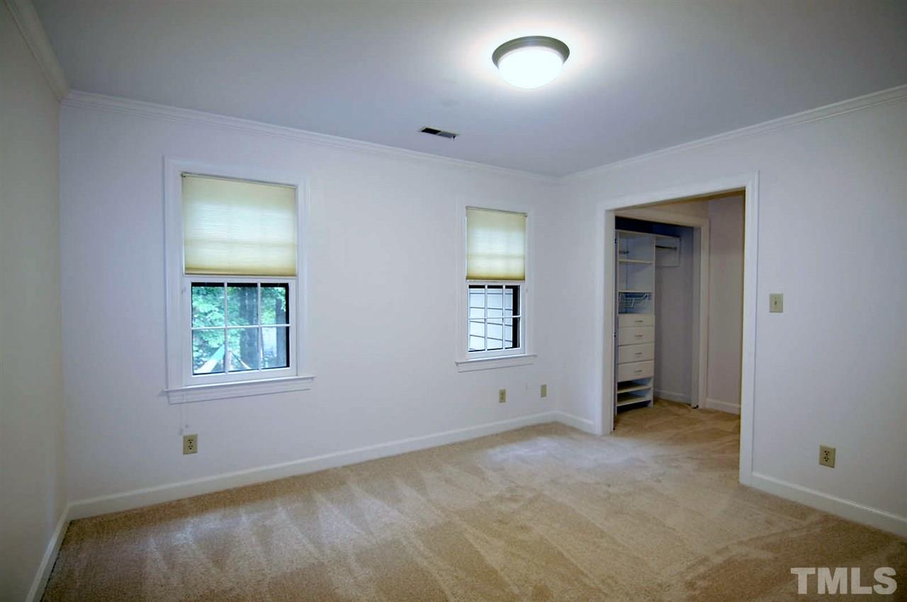 2001 Countrywood Road North Raleigh, NC 27615 - Photo 16 of 25 an empty room with windows and closet