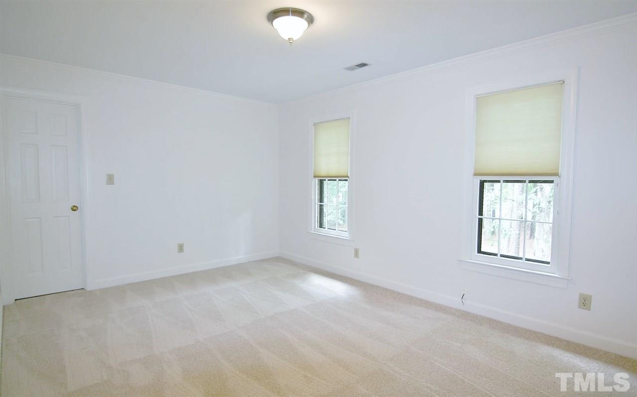 2001 Countrywood Road North Raleigh, NC 27615 - Photo 18 of 25 an empty room with windows