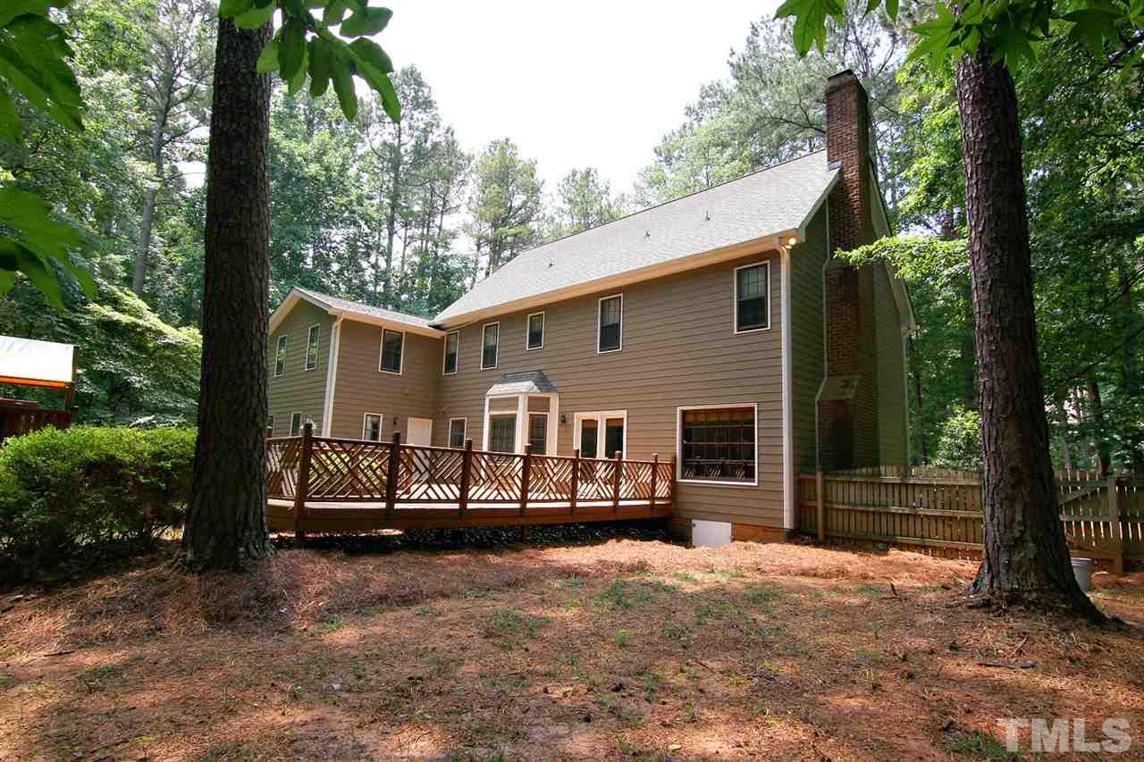 2001 Countrywood Road North Raleigh, NC 27615 - Photo 22 of 25 a view of a house with a backyard and balcony