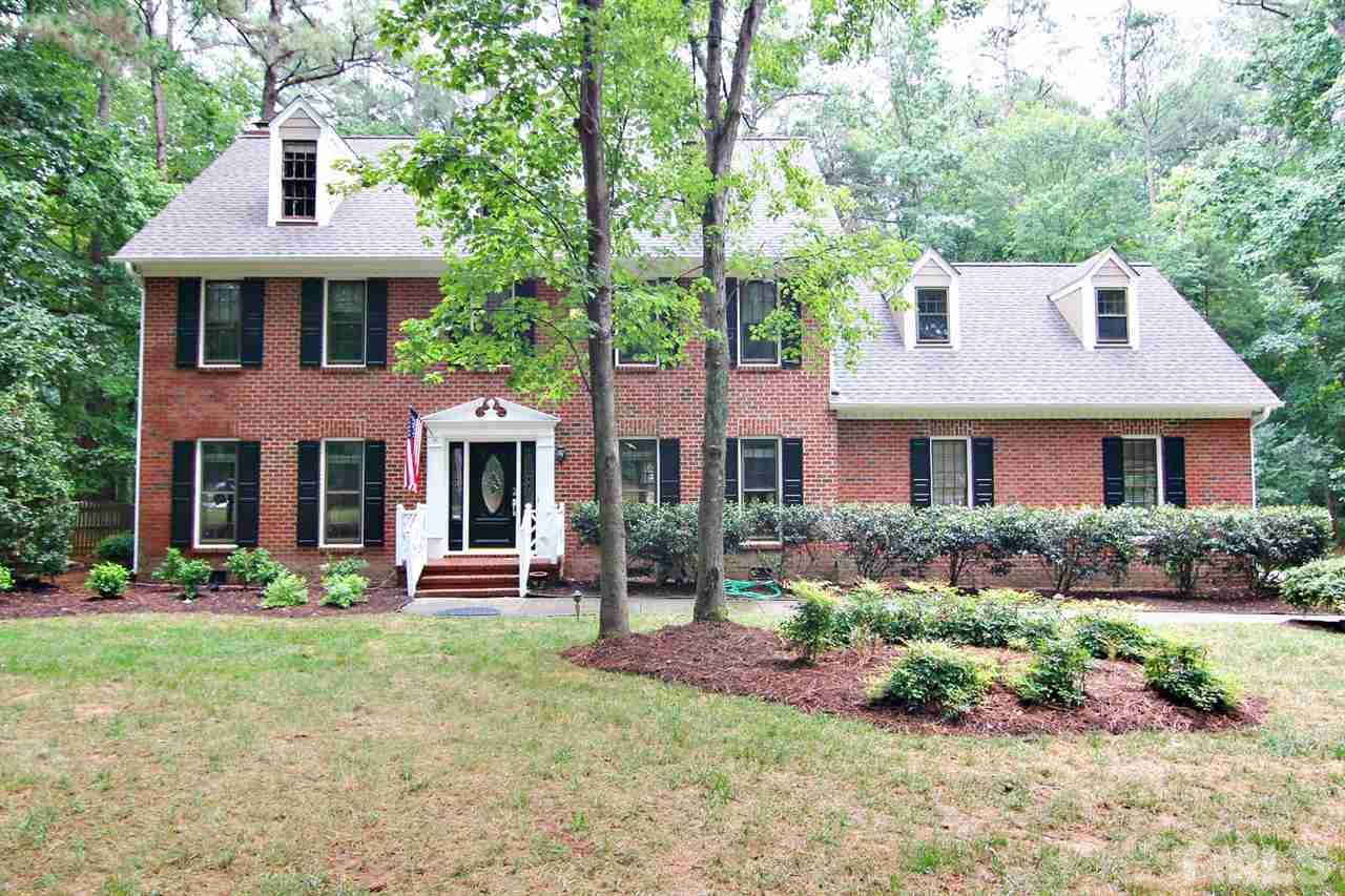 2001 Countrywood Road North Raleigh, NC 27615 - Photo 25 of 25 a front view of a house with garden