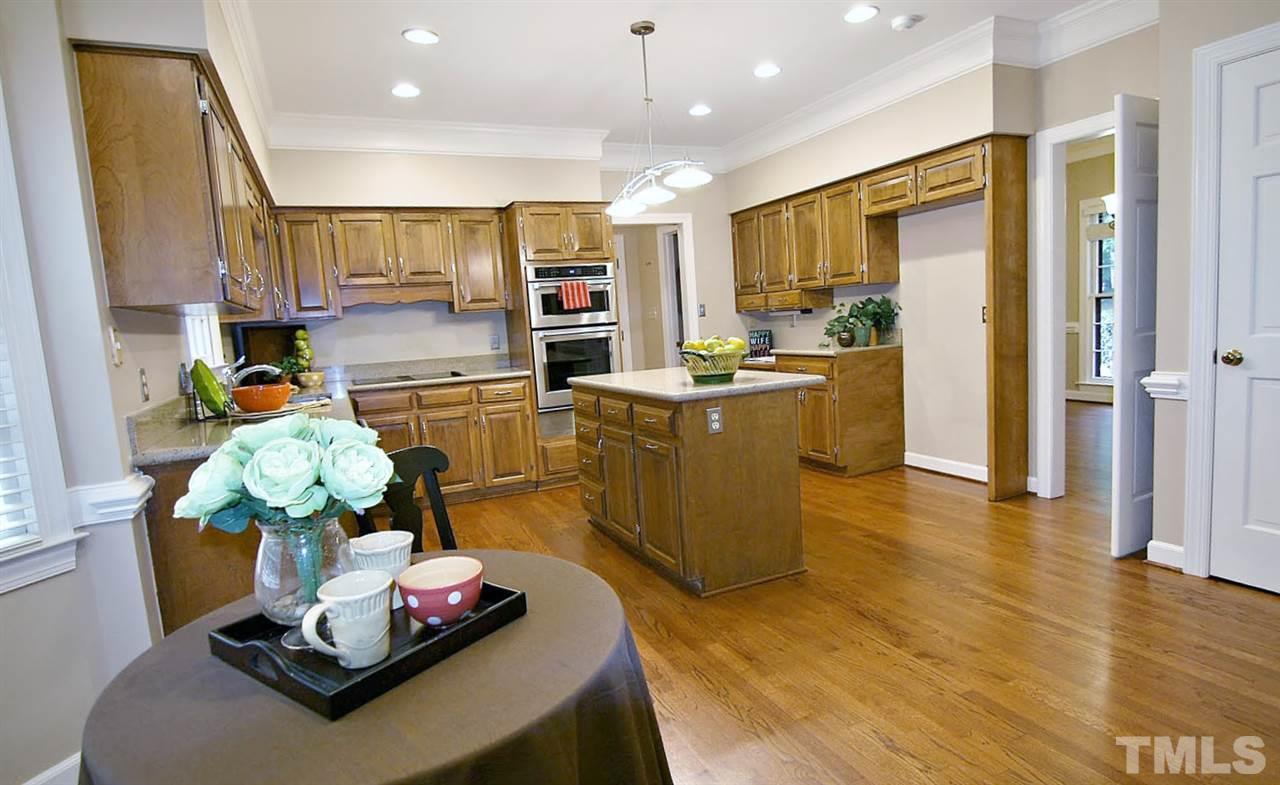 2001 Countrywood Road North Raleigh, NC 27615 - Photo 5 of 25 a room with kitchen island stainless steel appliances lots of counter top space