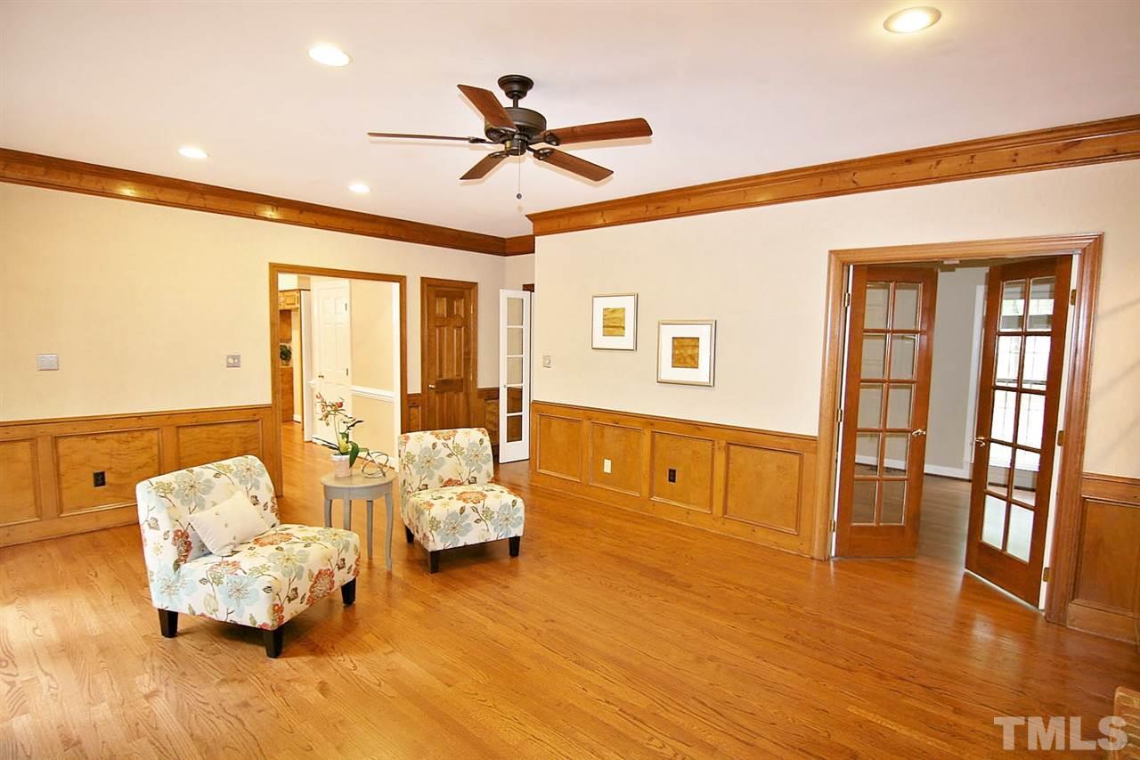 2001 Countrywood Road North Raleigh, NC 27615 - Photo 9 of 25 a living room with furniture and wooden floor