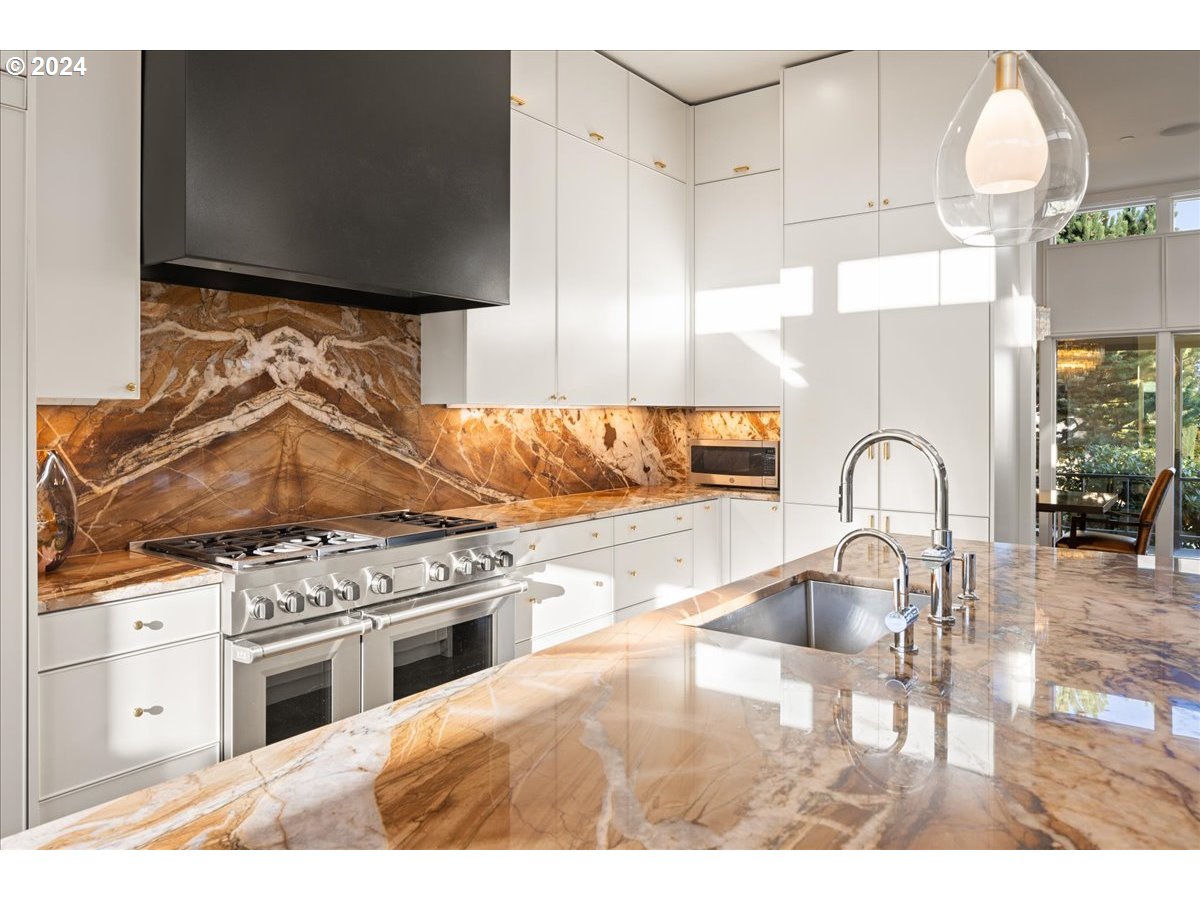1933 Highlands Loop Lake Oswego, OR 97034 - Photo 14 of 48 a kitchen with a stove and a white cabinets
