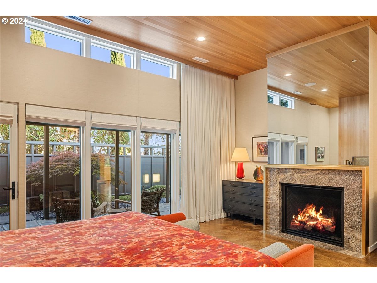 1933 Highlands Loop Lake Oswego, OR 97034 - Photo 19 of 48 a living room with furniture a fireplace and a large window