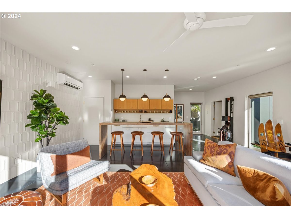 1933 Highlands Loop Lake Oswego, OR 97034 - Photo 26 of 48 a living room with furniture a potted plant and a table