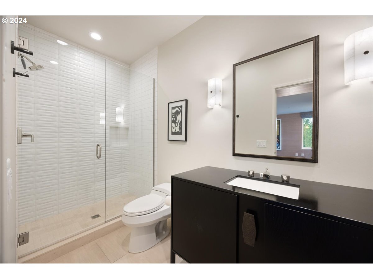 1933 Highlands Loop Lake Oswego, OR 97034 - Photo 33 of 48 a bathroom with a granite countertop sink a toilet a mirror and shower