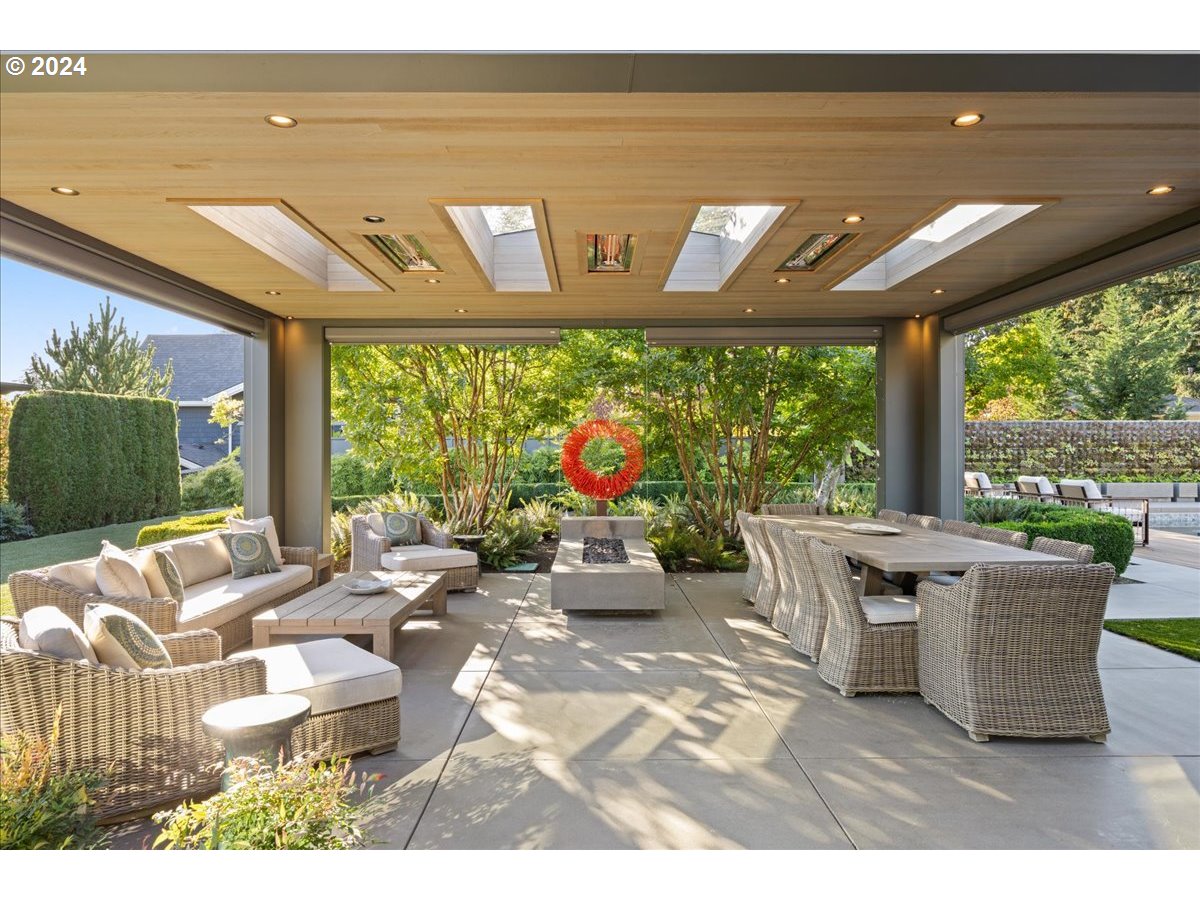 1933 Highlands Loop Lake Oswego, OR 97034 - Photo 40 of 48 a living room with patio furniture and a floor to ceiling window