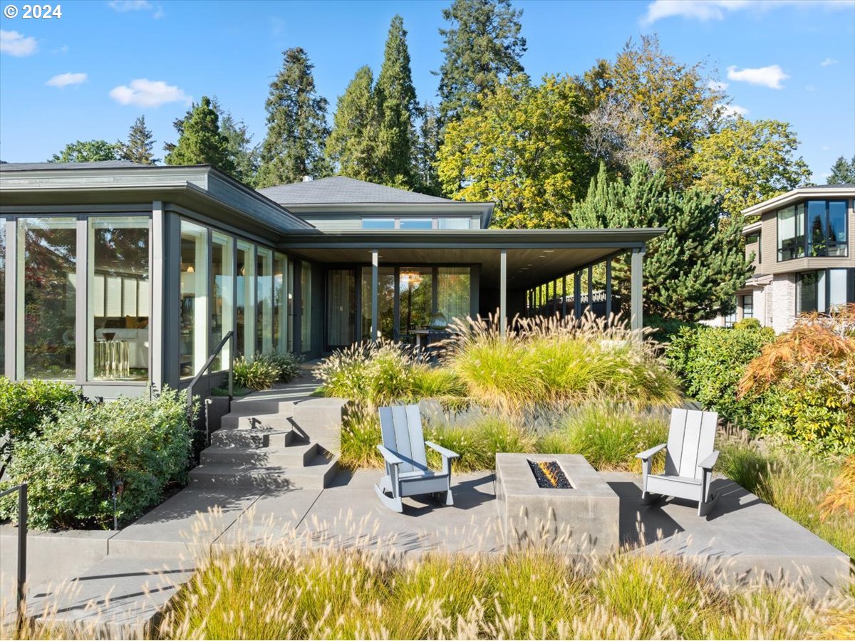 1933 Highlands Loop Lake Oswego, OR 97034 - Photo 6 of 48 a view of a patio with table and chairs potted plants and large tree