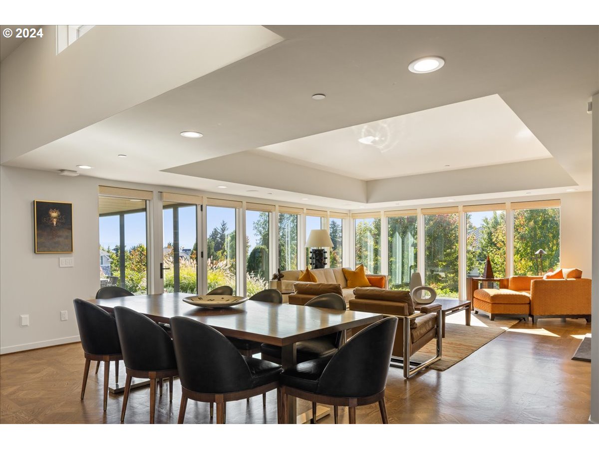 1933 Highlands Loop Lake Oswego, OR 97034 - Photo 9 of 48 a view of a dining room with furniture and a large window