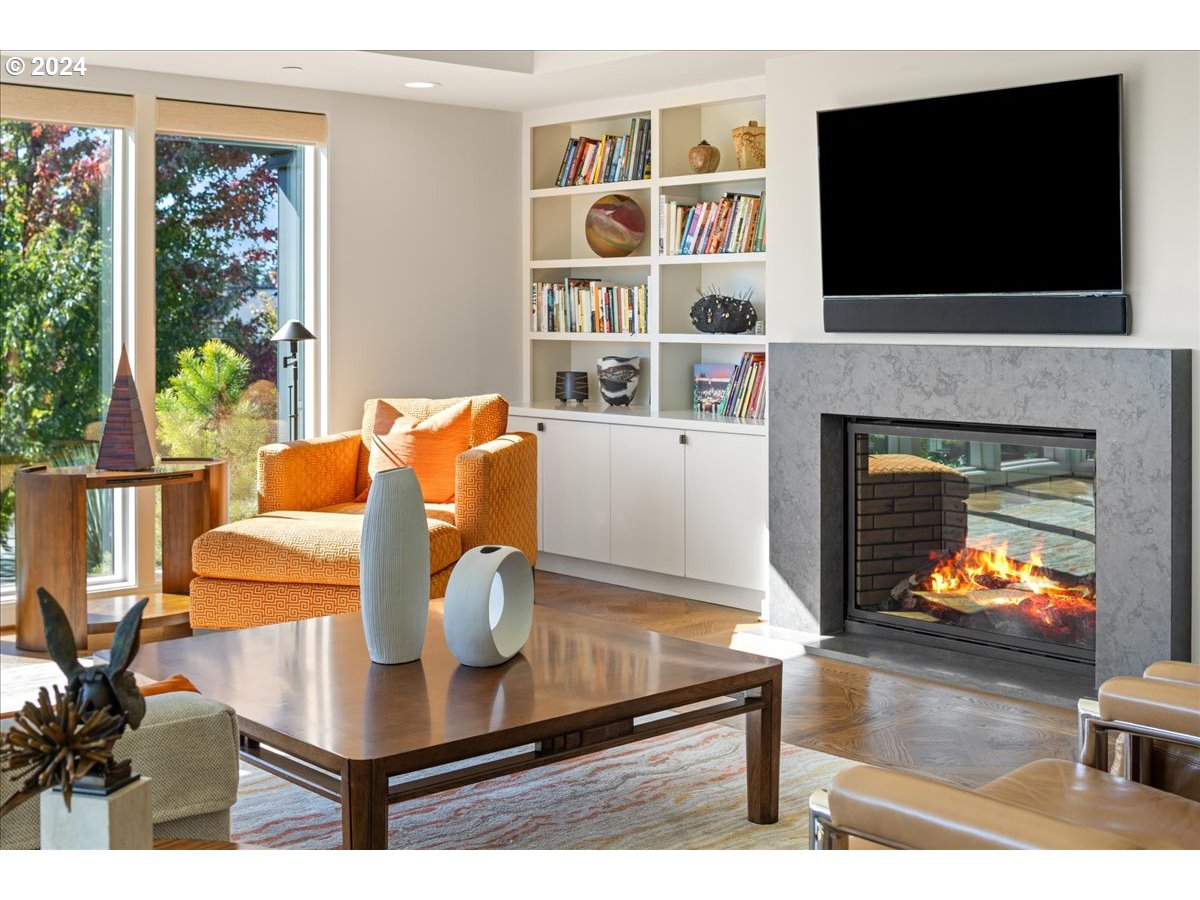 1933 Highlands Loop Lake Oswego, OR 97034 - Photo 10 of 48 a living room with fireplace furniture and a flat screen tv