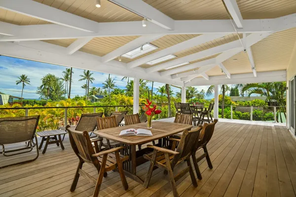a view of a patio with table and chairs