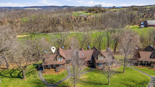 a aerial view of a house with a lake view