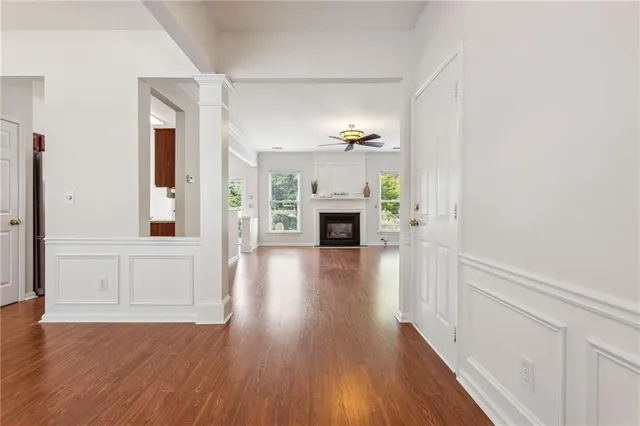 wooden floor in an empty room with a window
