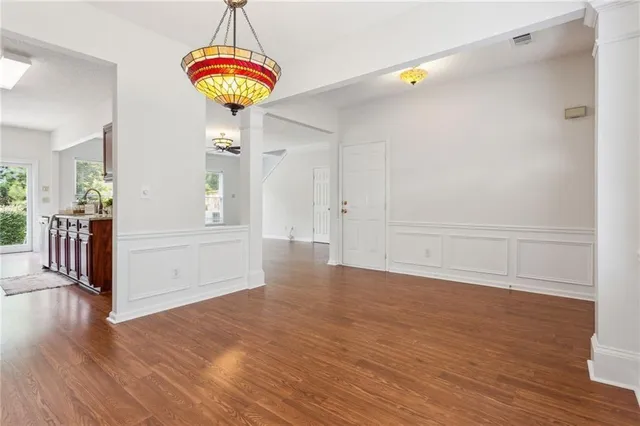 a view of a room with wooden floor