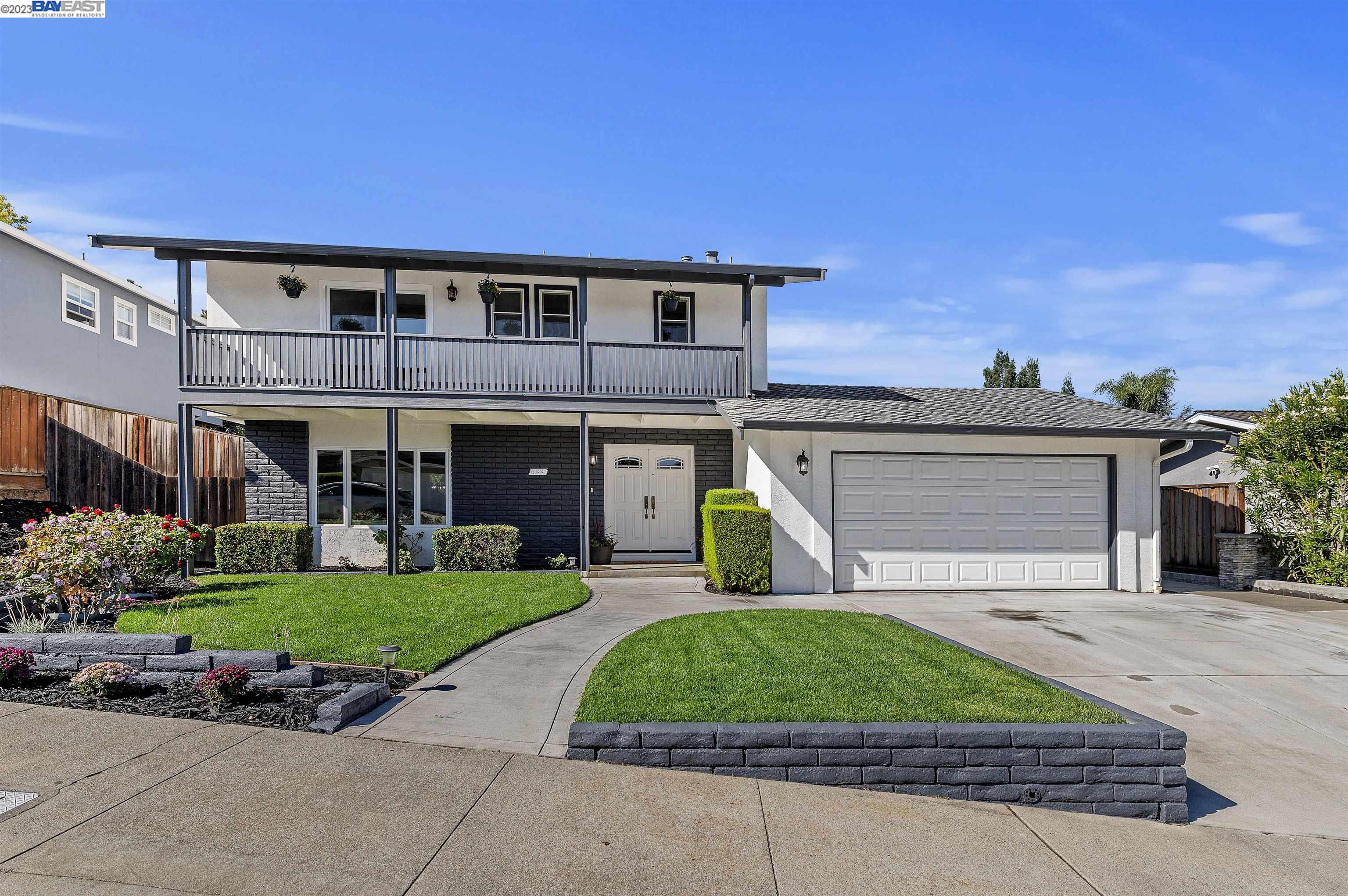 433 Mavis Drive Pleasanton, CA 94566 - Photo 1 of 1 a front view of a house with a garden and plants