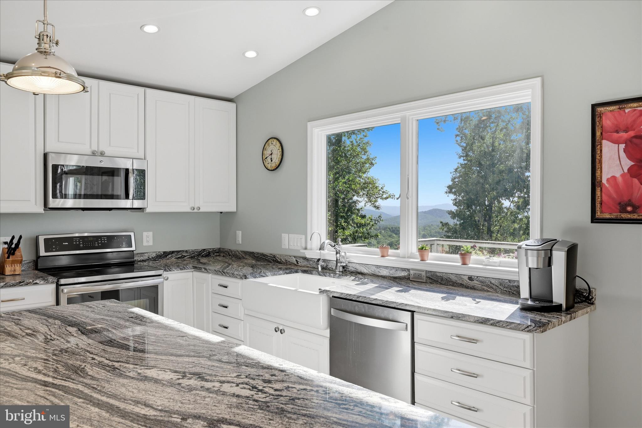 500 Delicious Road Linden, VA 22642 - Photo 8 of 80 a kitchen with granite countertop a stove a sink a counter space and cabinets