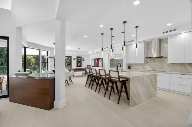 a spacious bedroom with a bed and a couch