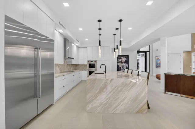 a bedroom with furniture and a flat screen tv
