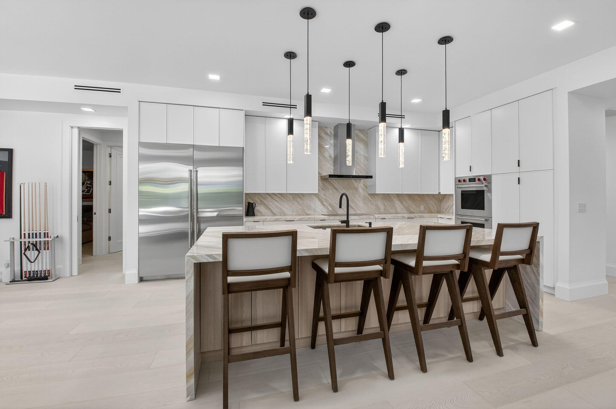 5723 Hamilton Way Boca Raton, FL 33496 - Photo 19 of 111 a large kitchen with stainless steel appliances kitchen island granite countertop a table chairs and a refrigerator