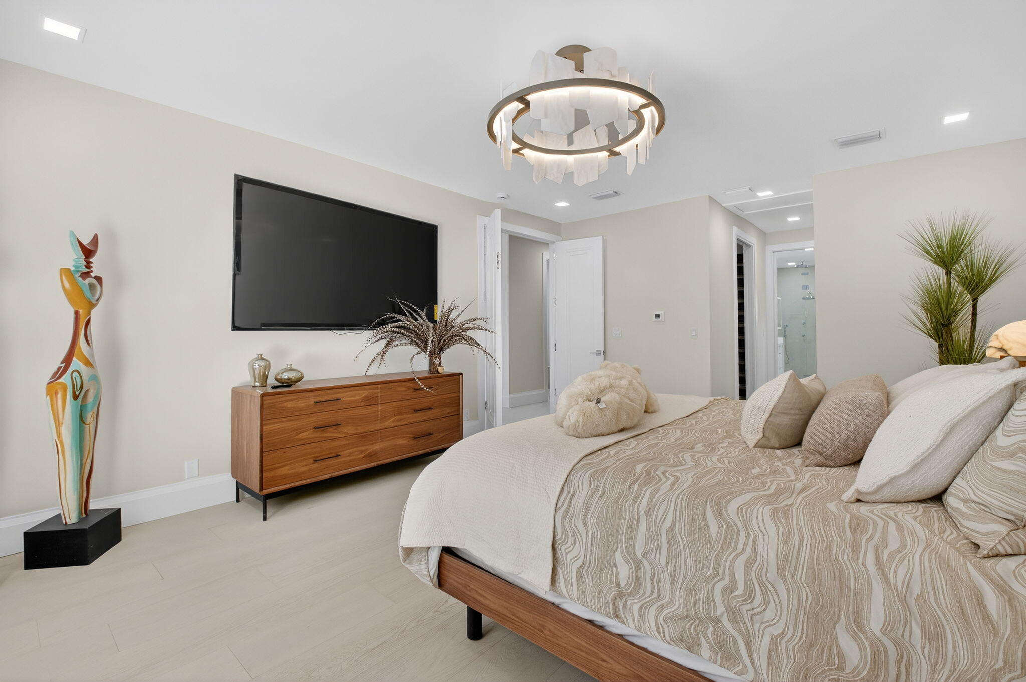 5723 Hamilton Way Boca Raton, FL 33496 - Photo 49 of 111 a bedroom with a bed and a flat screen tv