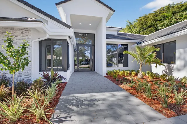 a dining room with furniture window and wooden floor