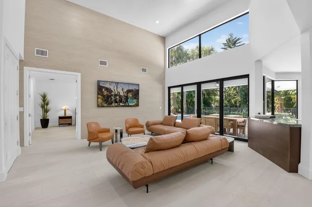 a large kitchen with stainless steel appliances kitchen island granite countertop a lot of counter space and a sink