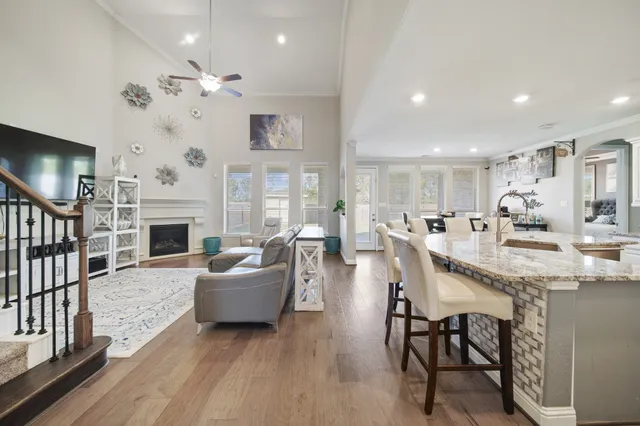a living room with fireplace furniture and a flat screen tv