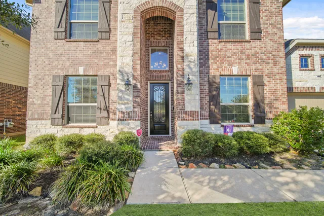 a view of entrance of the house with potted plants