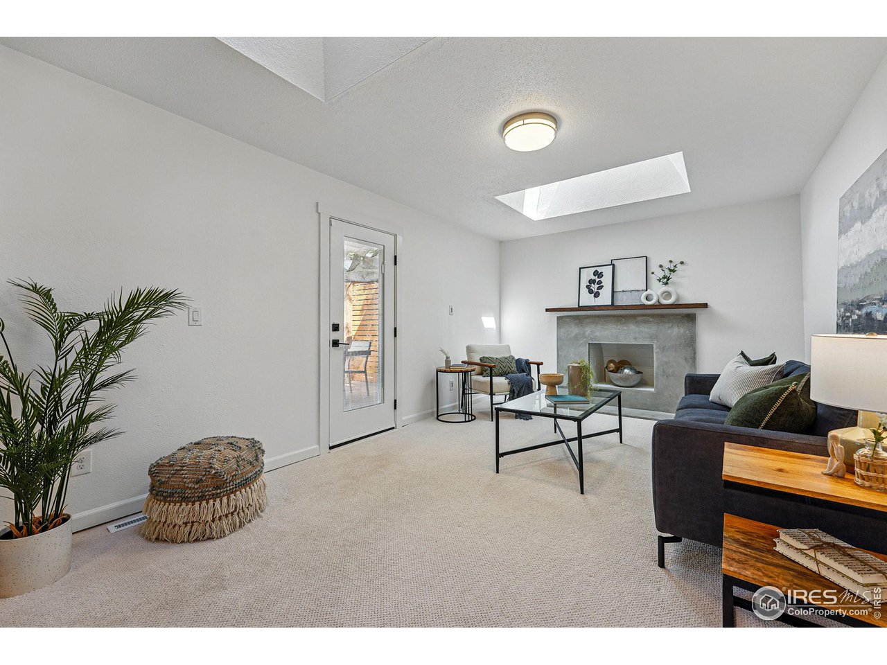 3495 Endicott Drive Boulder, CO 80305 - Photo 12 of 40 a living room with furniture and a fireplace