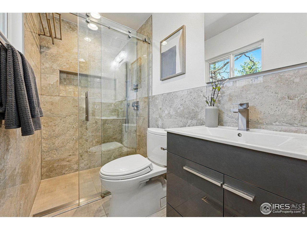 3495 Endicott Drive Boulder, CO 80305 - Photo 17 of 40 a bathroom with a sink toilet and shower