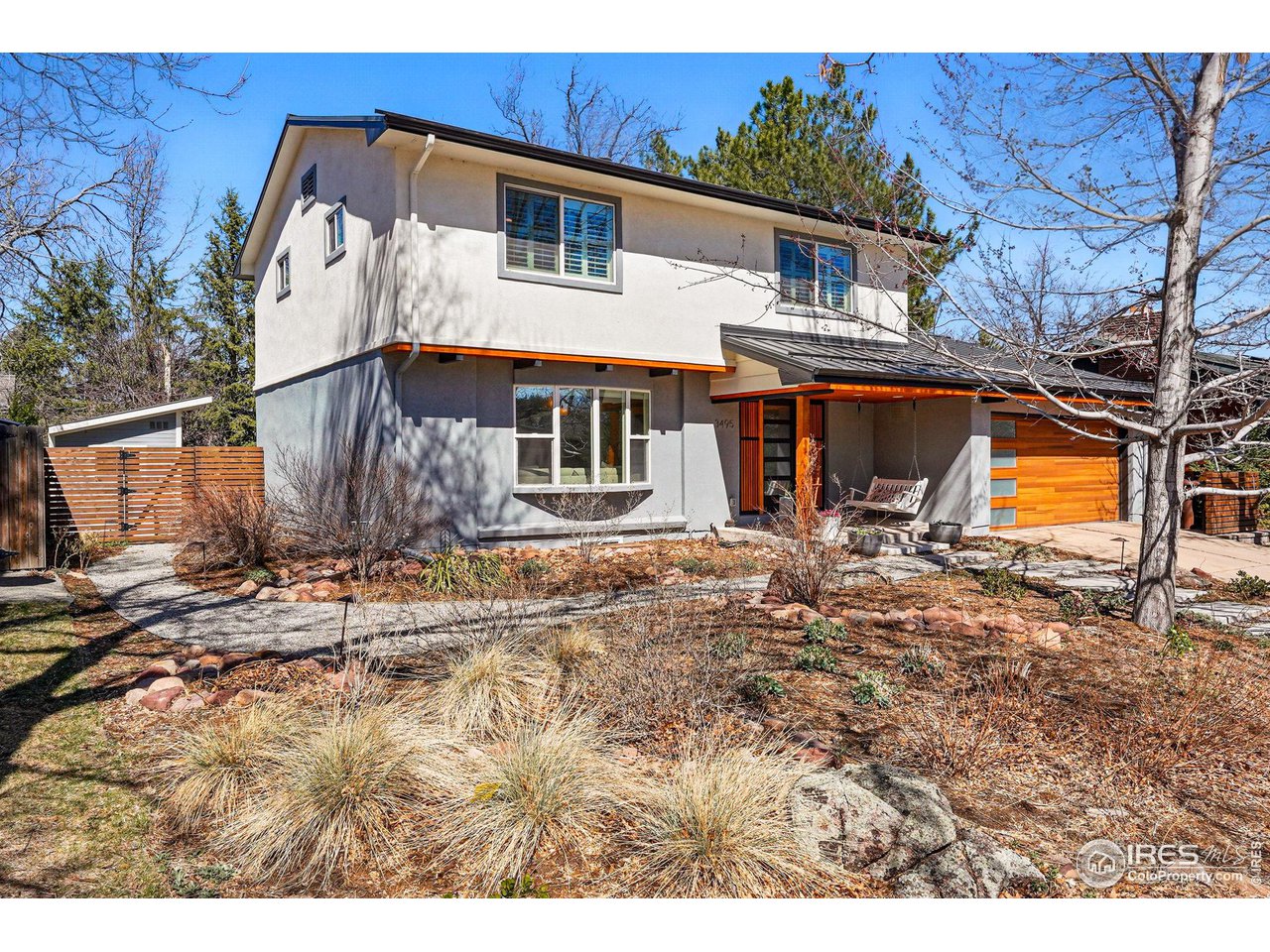 3495 Endicott Drive Boulder, CO 80305 - Photo 3 of 40 a backyard of a house with yard and outdoor seating